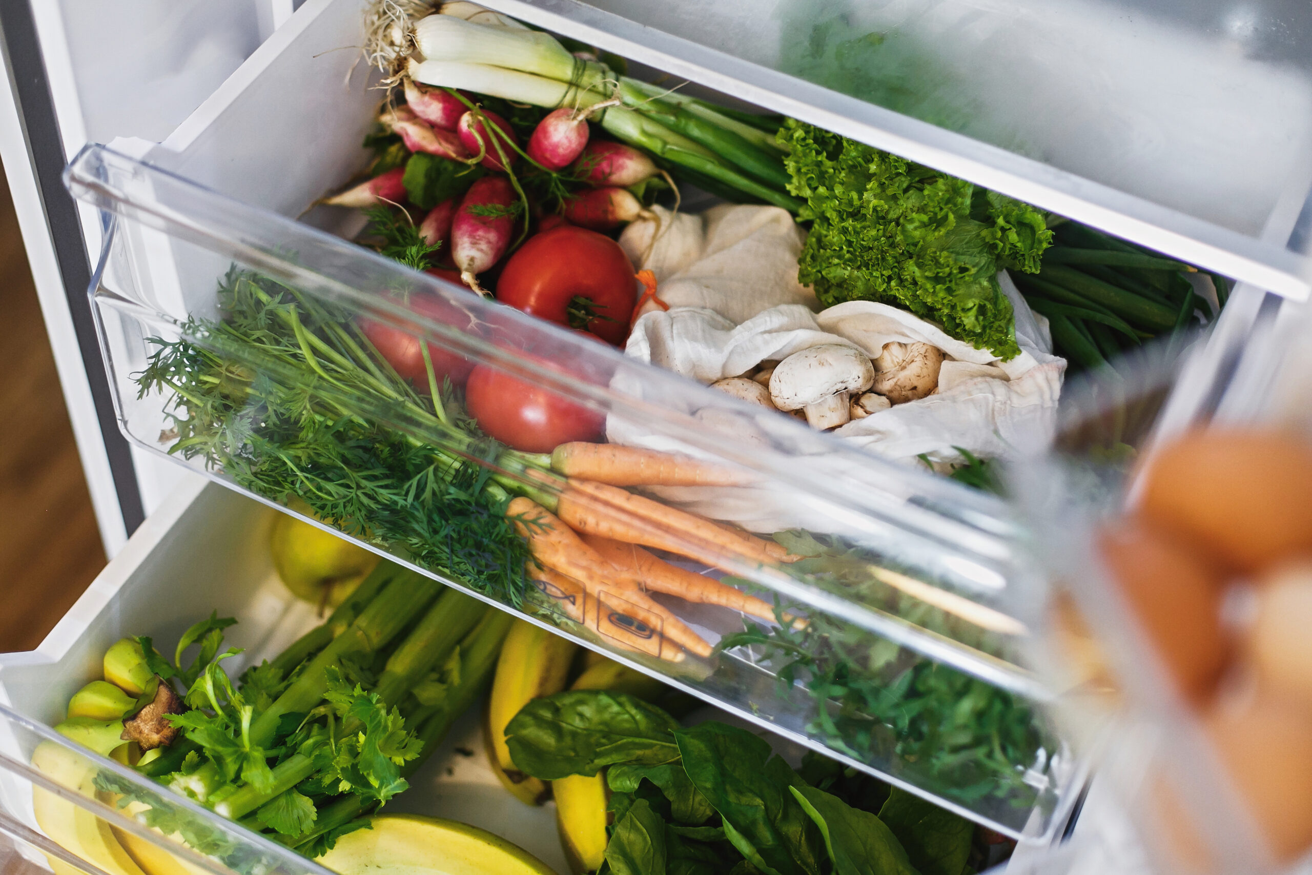 Zero waste grocery in fridge. Fresh vegetables in opened drawer